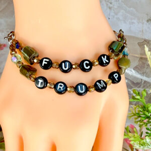 Fuck Trump letter bead bracelet with dyed green mother of pearl beads, one strand says 'fuck' the other strand says 'trump'. magnetic clasp
