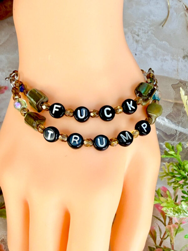 Fuck Trump letter bead bracelet with dyed green mother of pearl beads, one strand says 'fuck' the other strand says 'trump'. magnetic clasp
